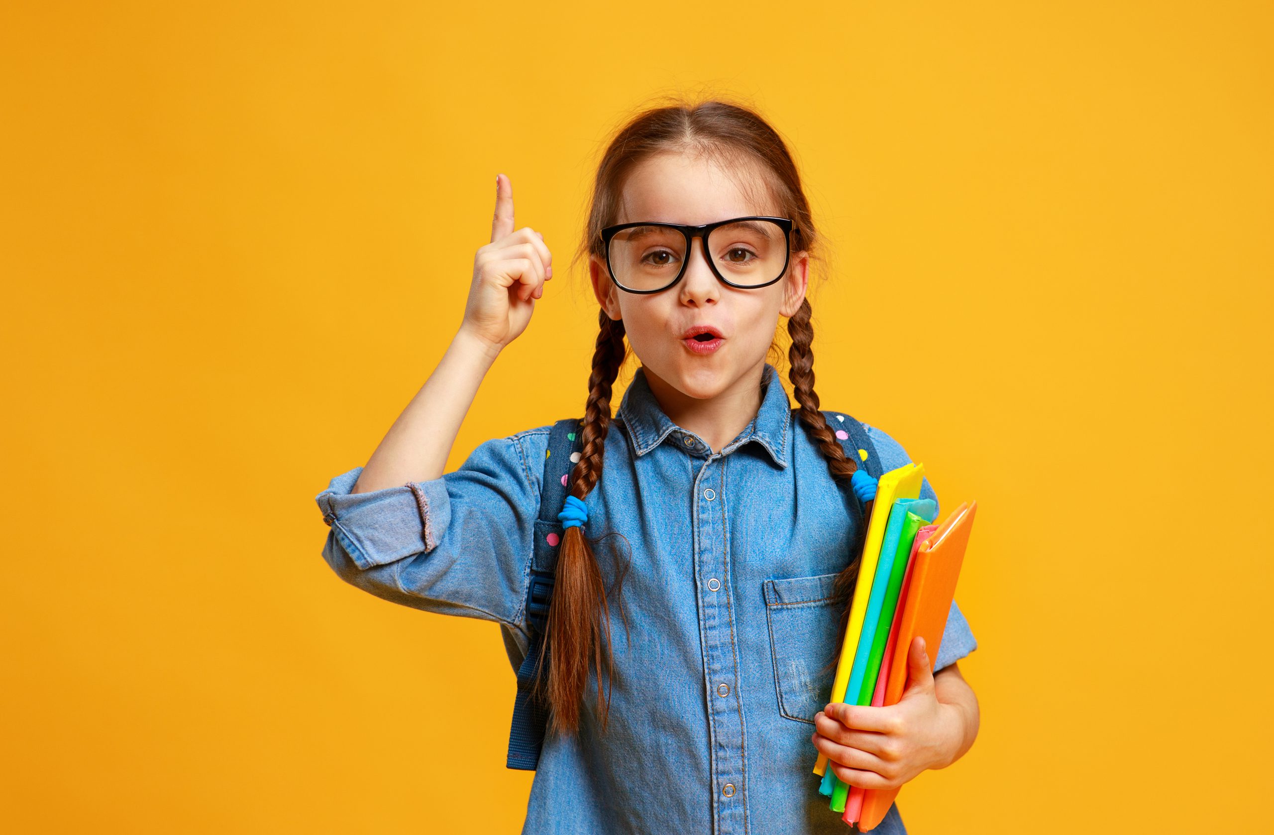 funny child school girl girl on yellow background